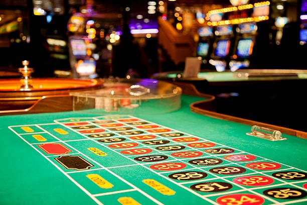 Card game table layout with dealer station and betting areas